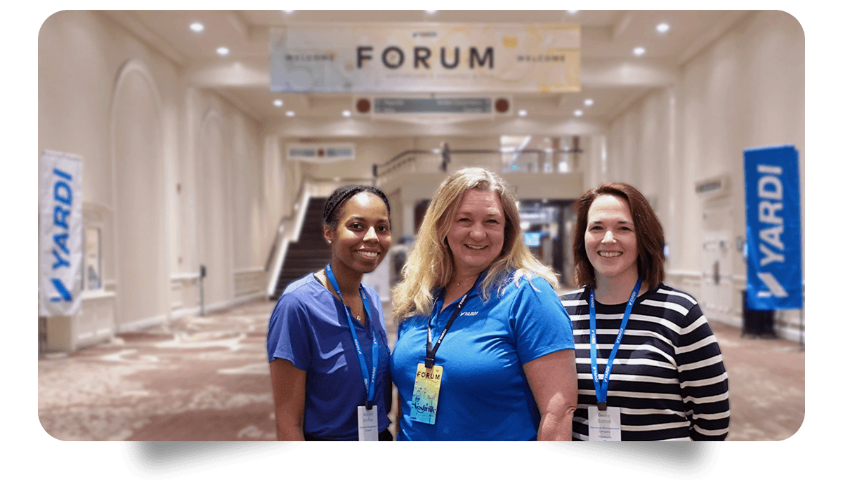 three women standing in front of forum signs